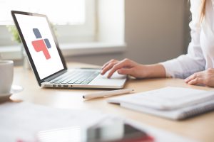 Person undertaking a First Aid course online