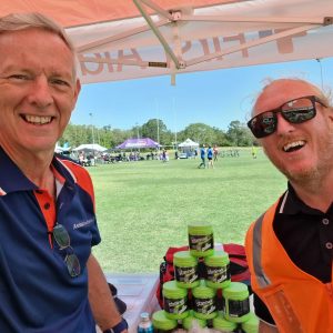 Two Sport & Event First Aiders on a sports field on the Sunshine Coast